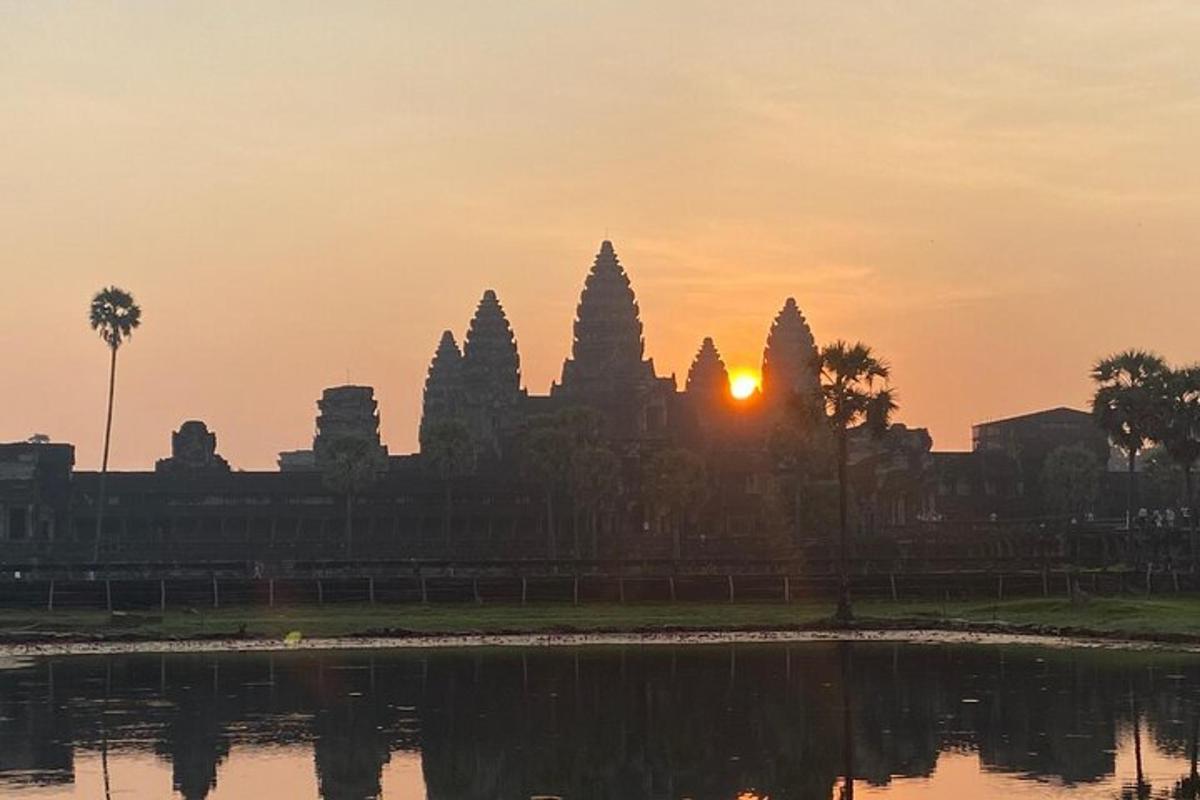 a sunset over the angkor wat temple