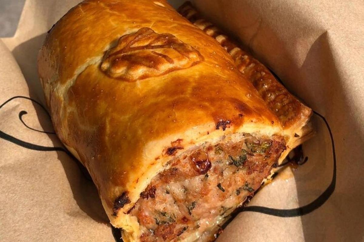 a close up of a pizza pie in a box