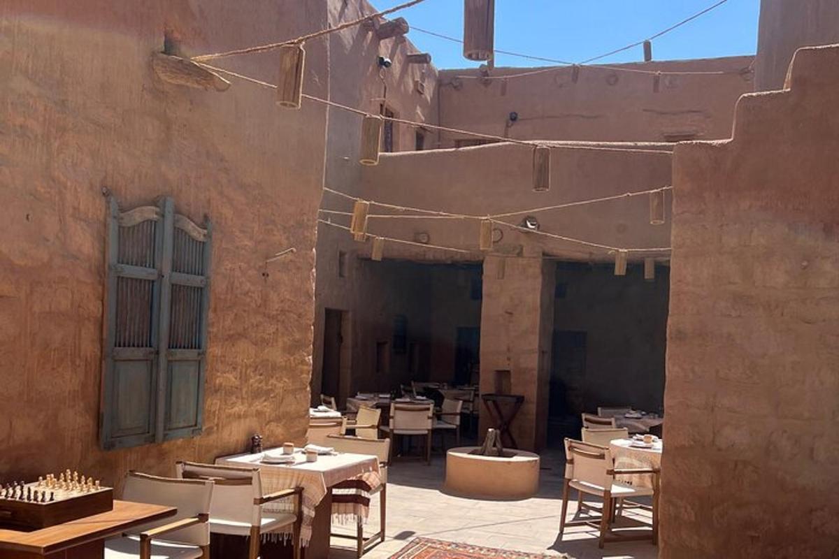 a patio with tables and chairs in a building