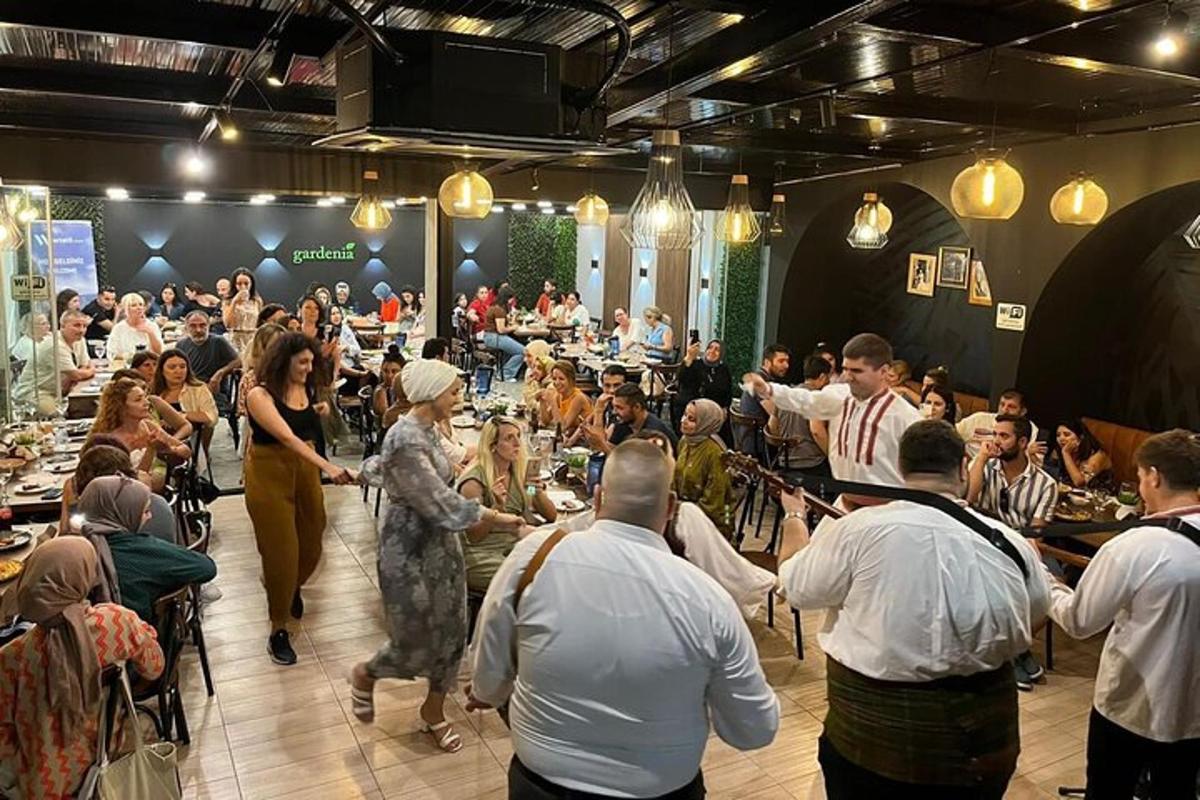 a group of people standing in a room with a crowd