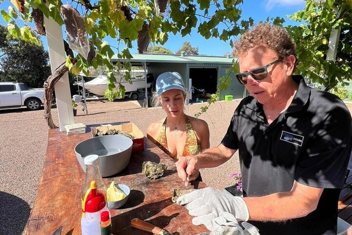 a man and a woman preparing food at a table