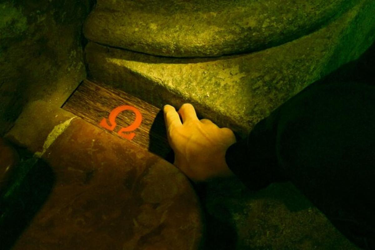 a person reaching for a red number on the floor
