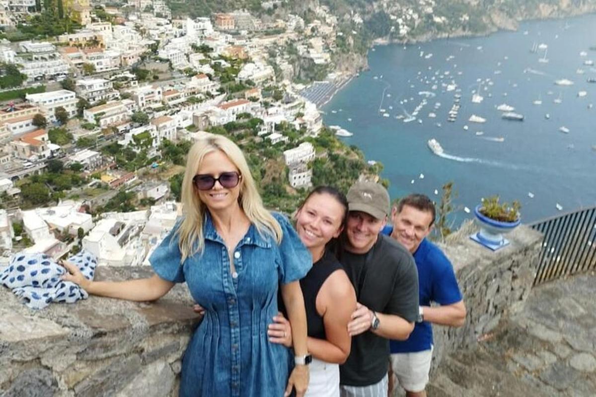 a group of people standing on top of a mountain