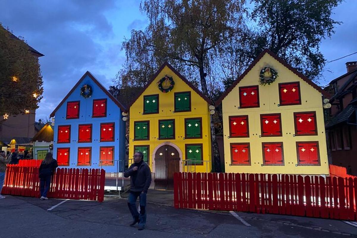 a man standing in front of a group of houses