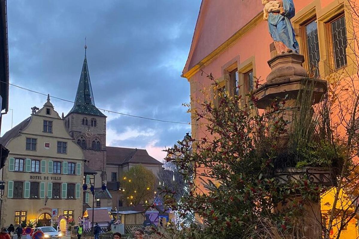 a statue of a person on a building in a city