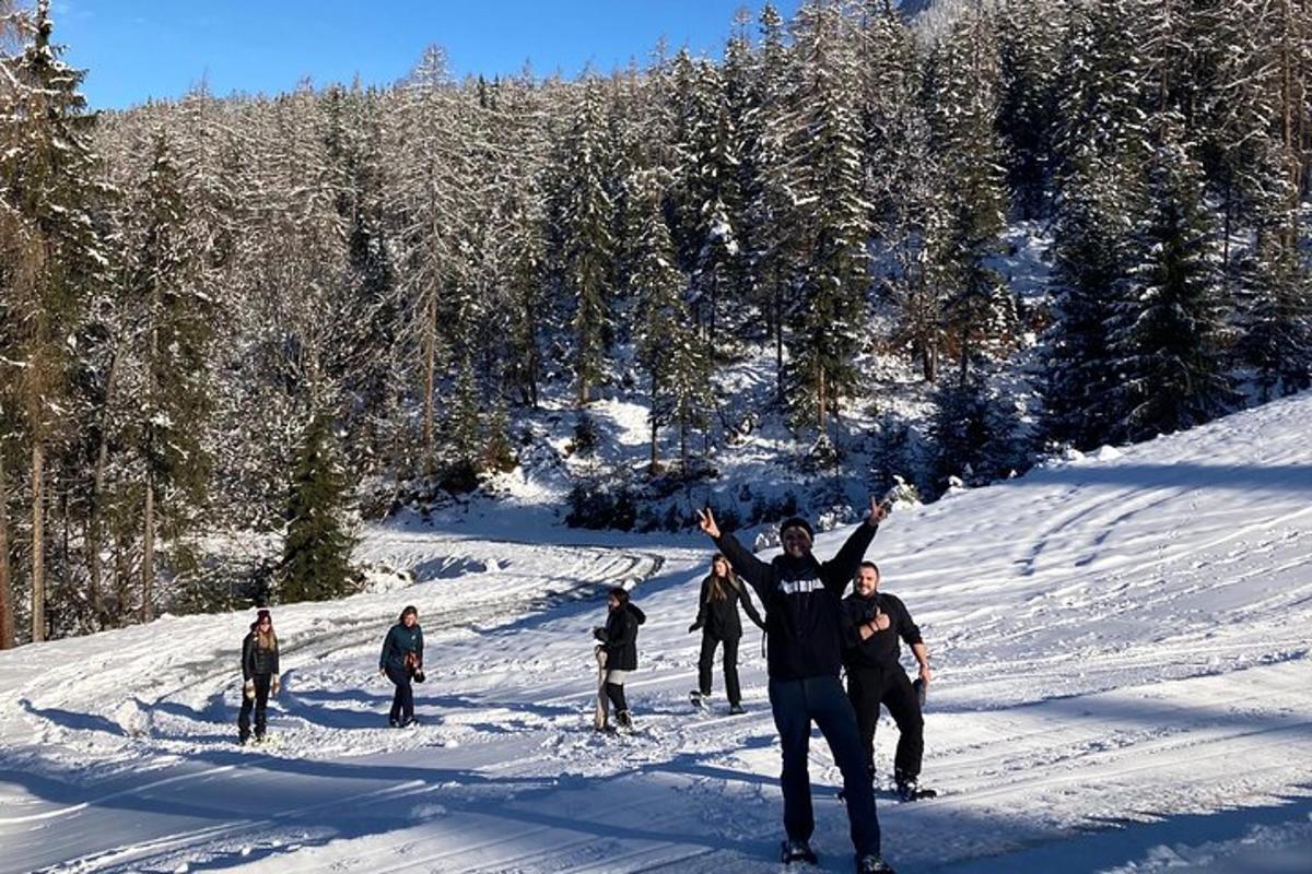 a group of people standing on a snow covered slope