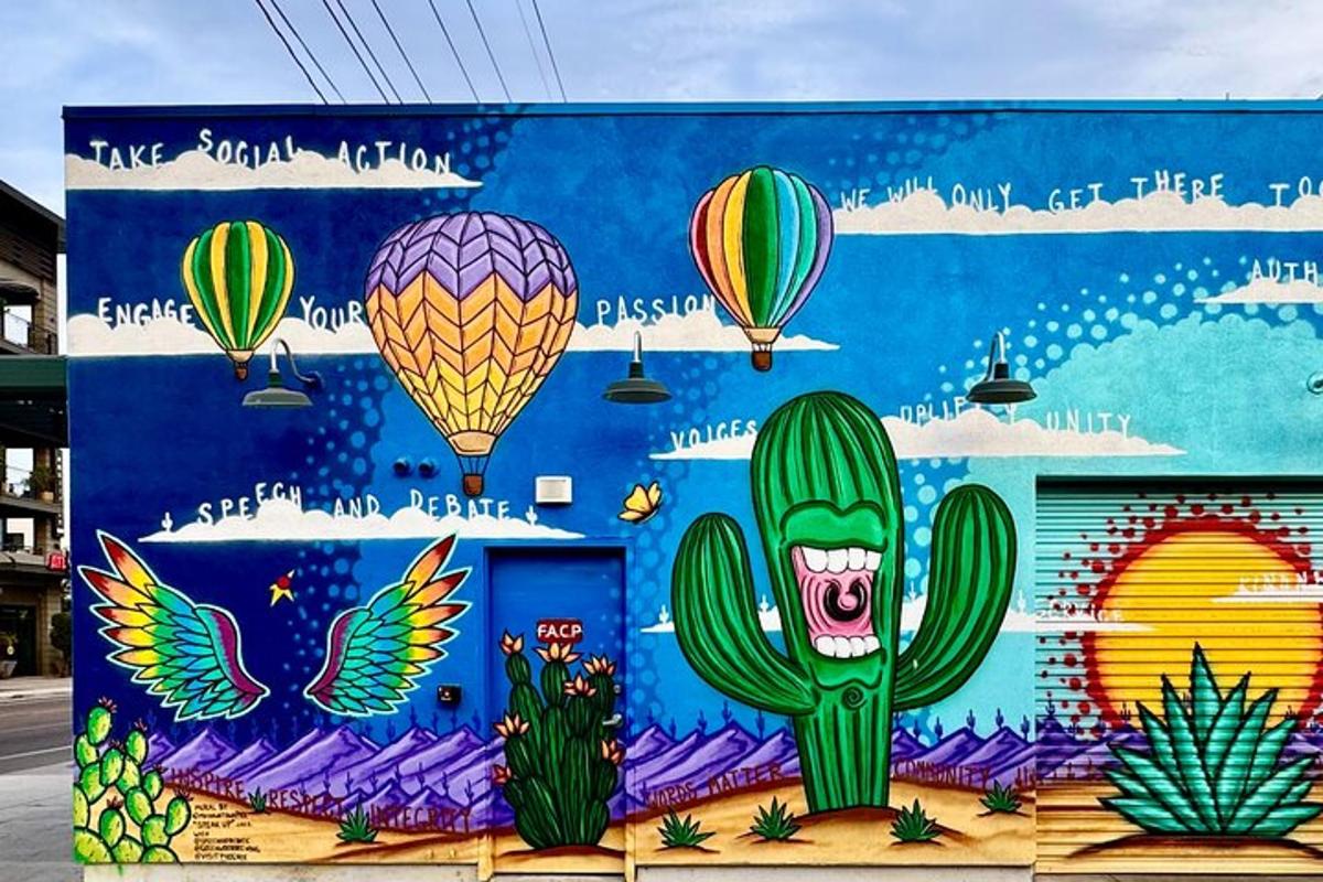 a mural of a cactus and hot air balloons