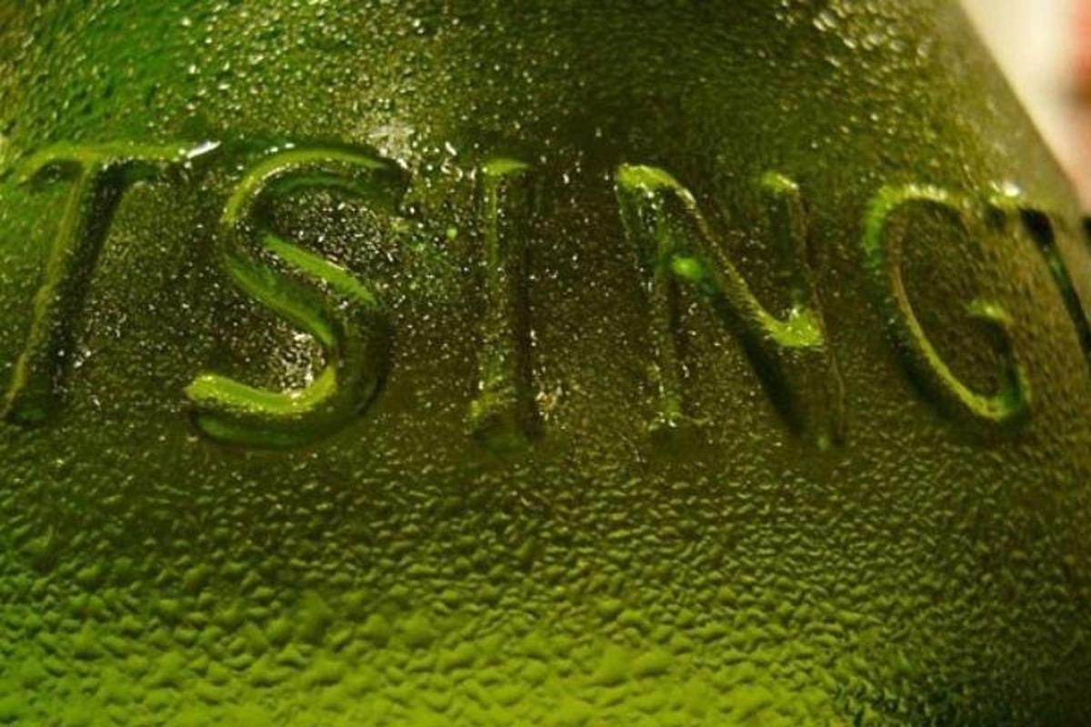 a green bottle with the word fish written on it
