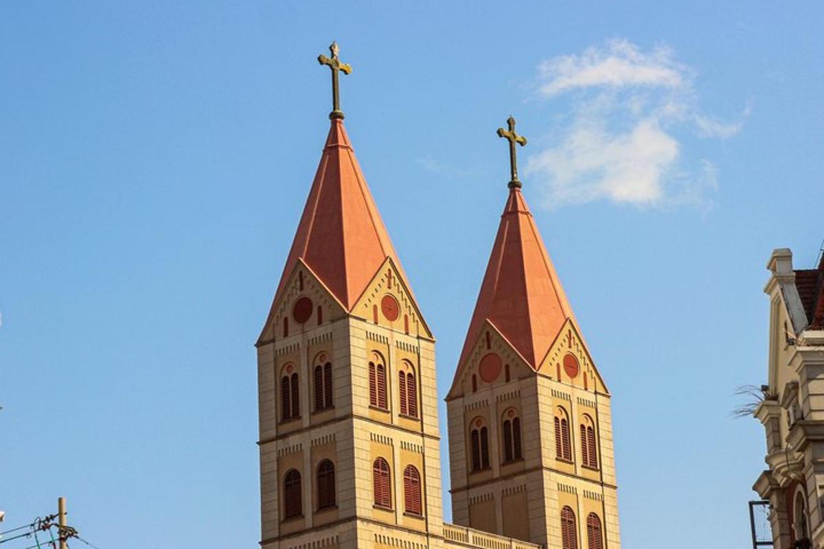 a church steeple with two crosses on top of it