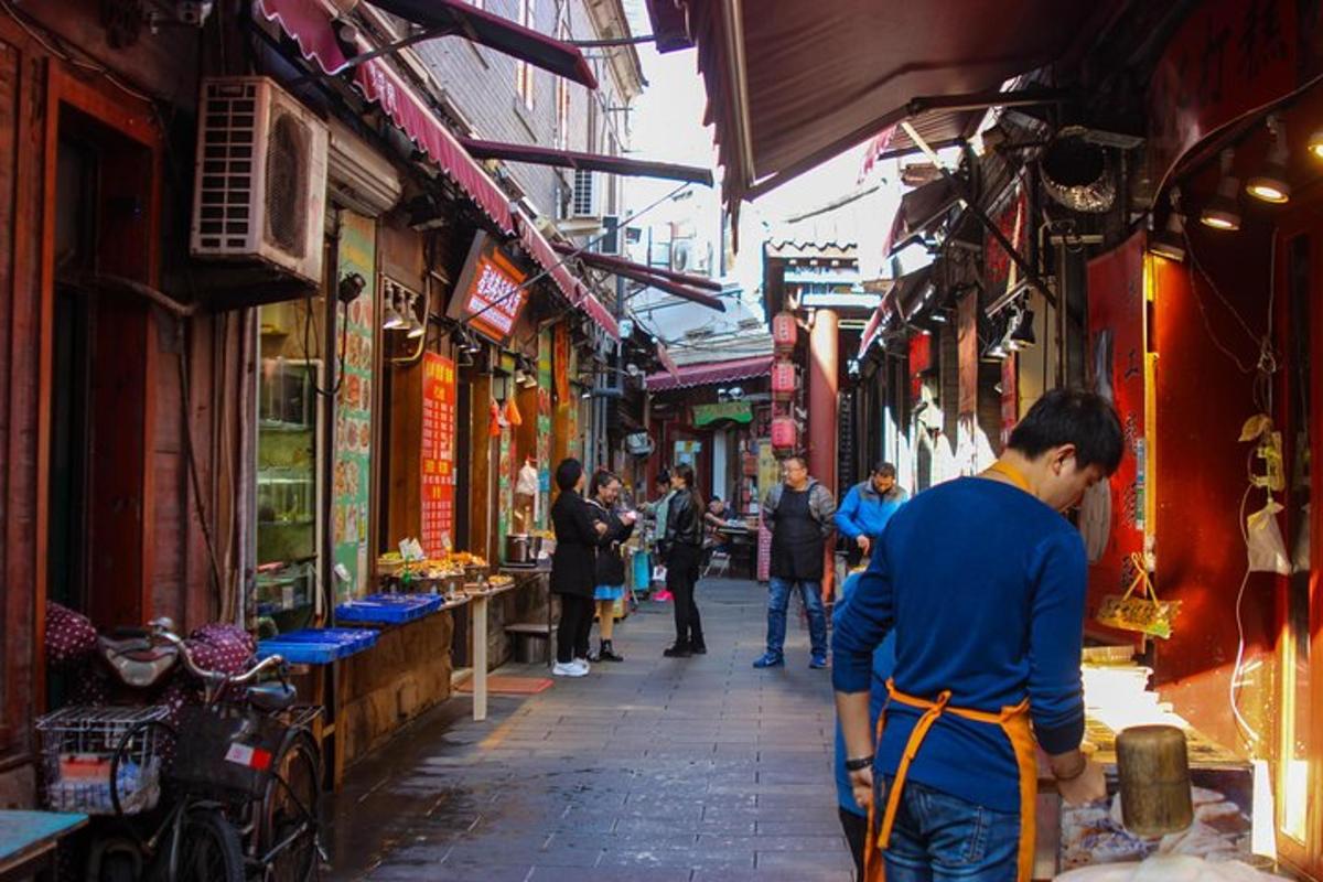 a man standing in an alley in a market