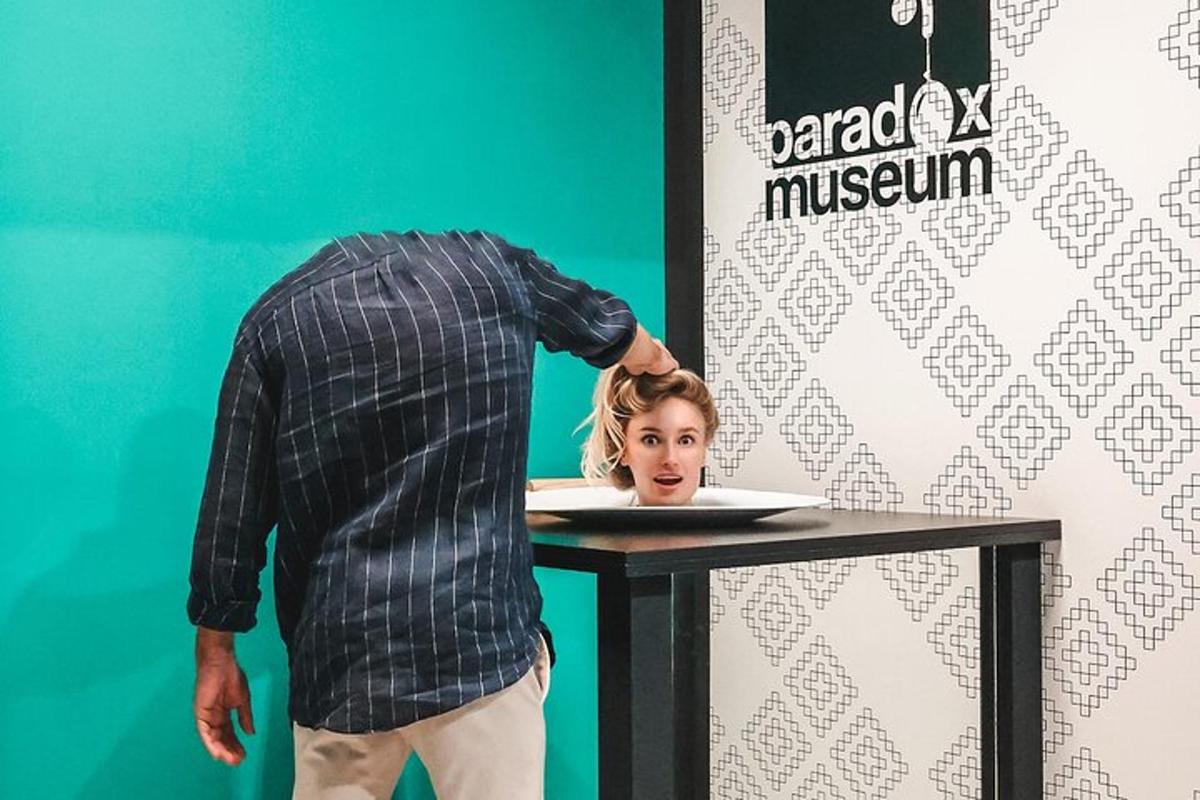 a man standing in front of a table with a woman