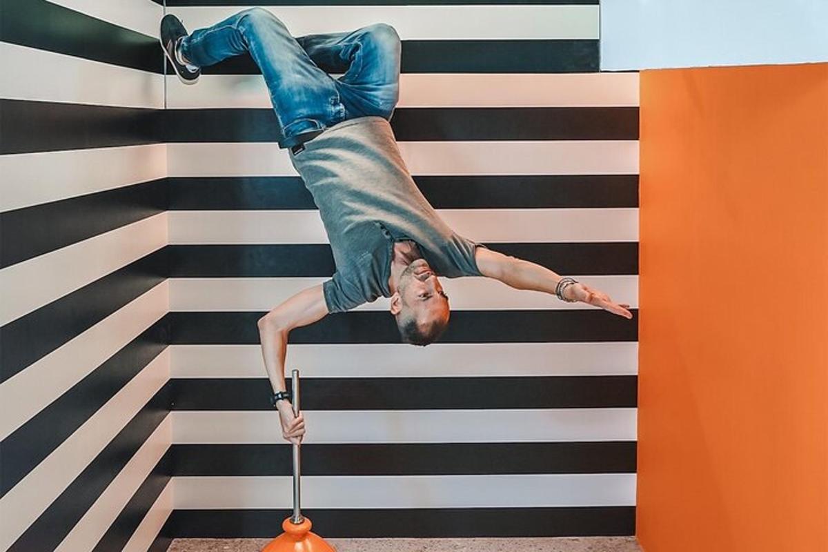 a man is doing a handstand on a suitcase