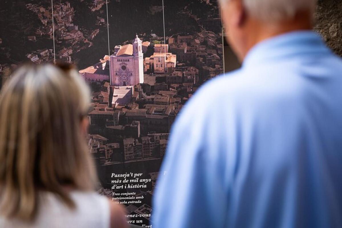 two people standing in front of a poster