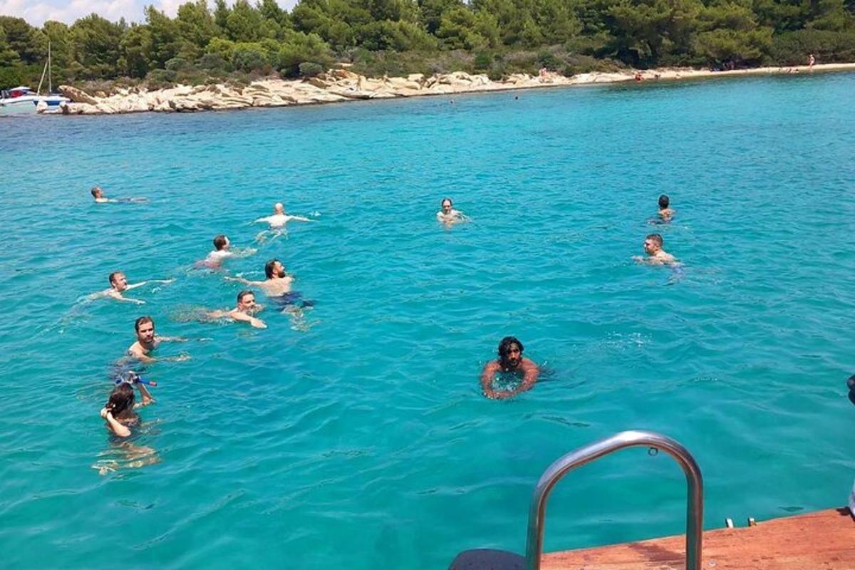 a group of people swimming in a body of water