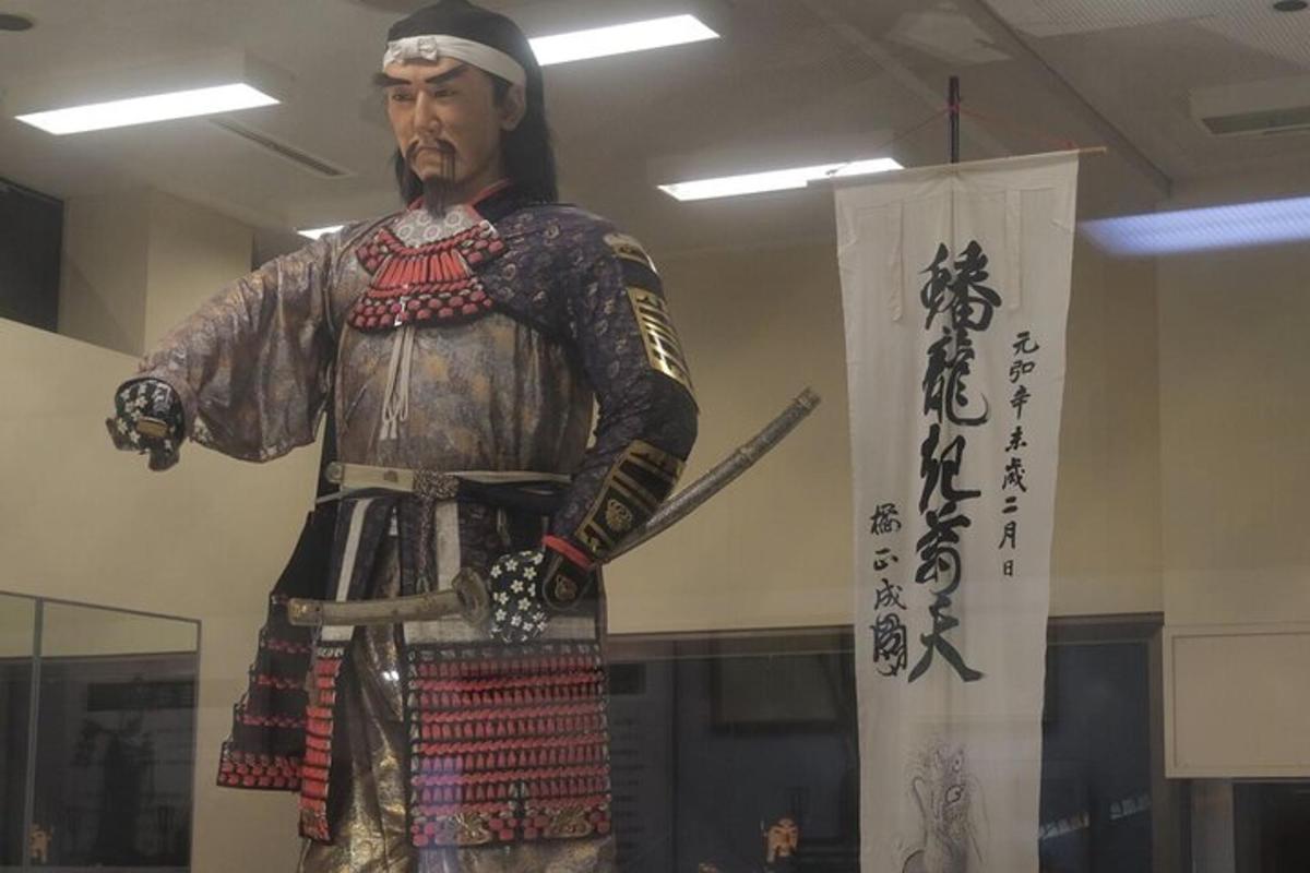 a statue of a man in armor holding a sword