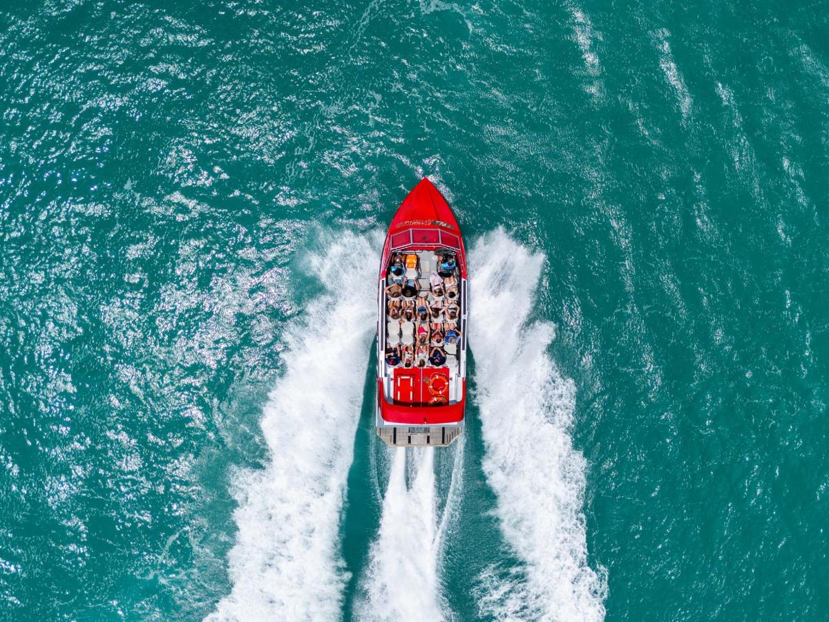 a red boat in the middle of the water