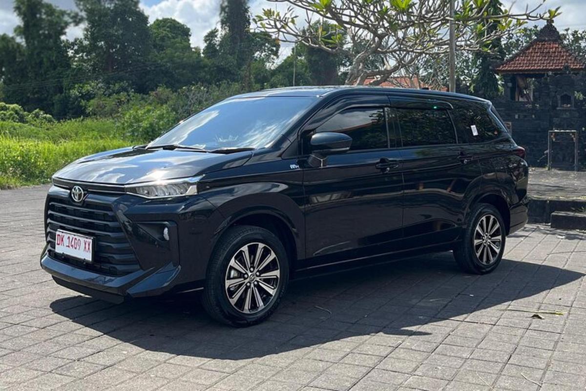 a black suv parked on a brick road