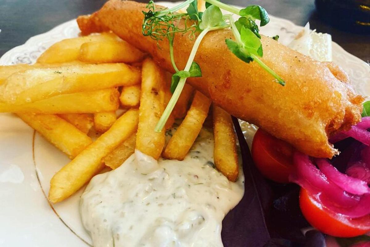 a plate of food with french fries and a sandwich