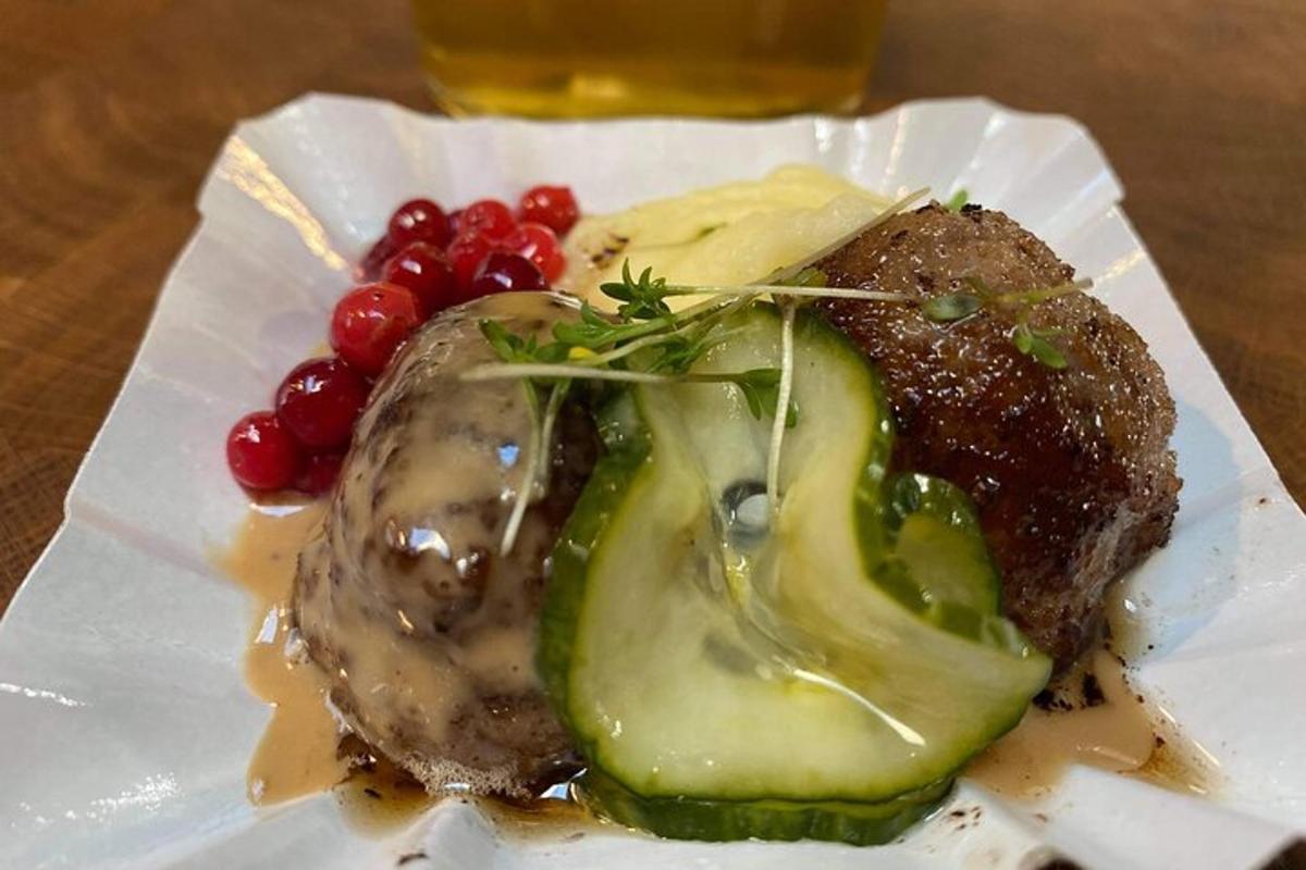 a plate of food with meat and vegetables on a table