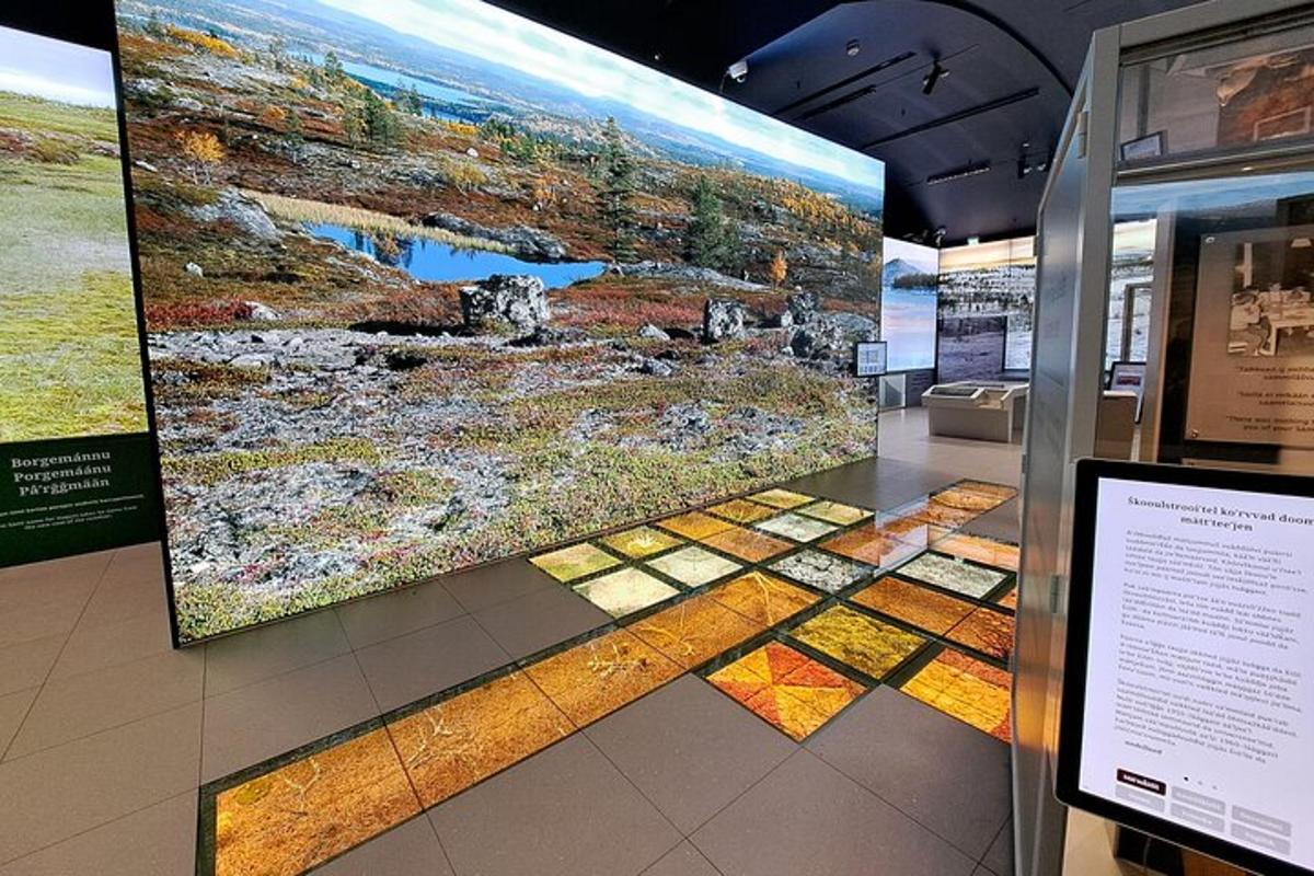 a display case in a museum with a large painting