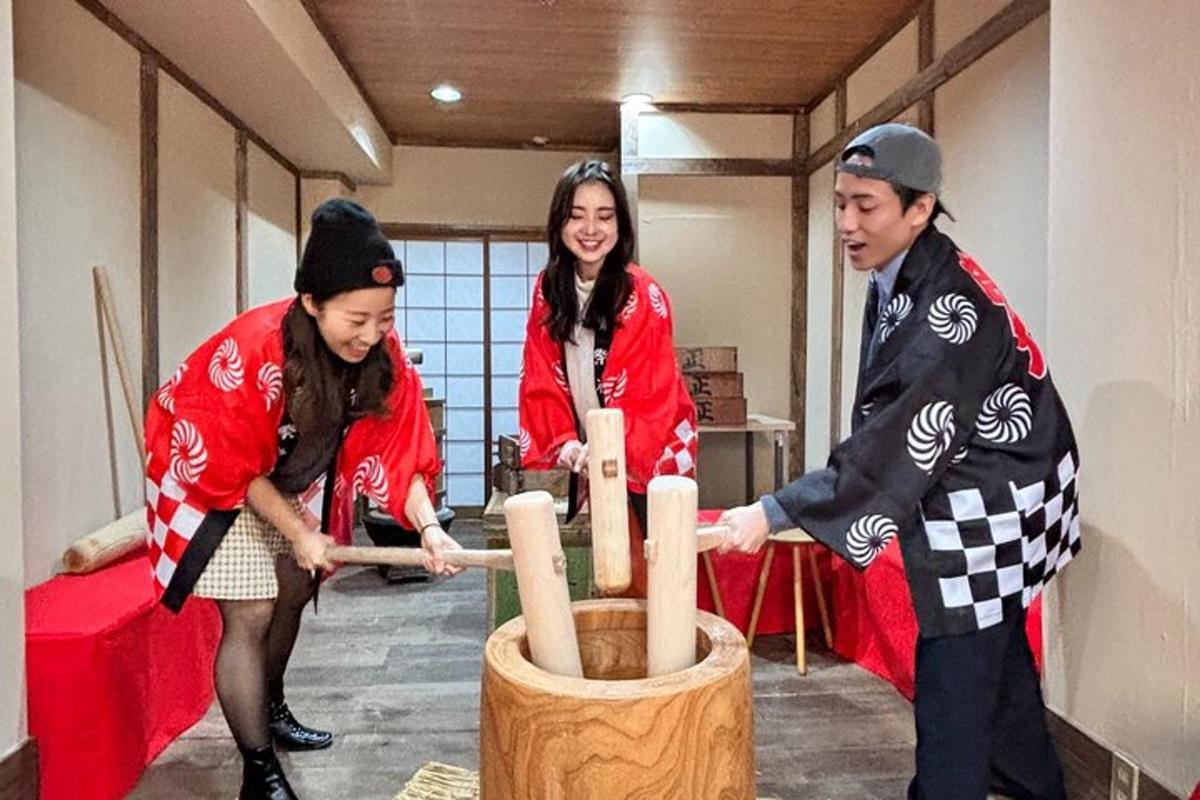 a group of people playing with a wooden instrument