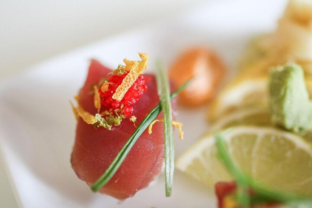 a piece of fruit on a plate with lemon slices