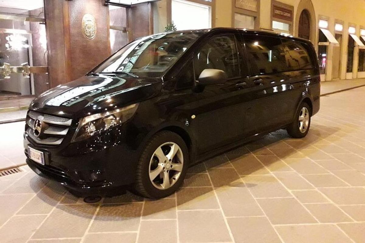 a small black car parked in a building