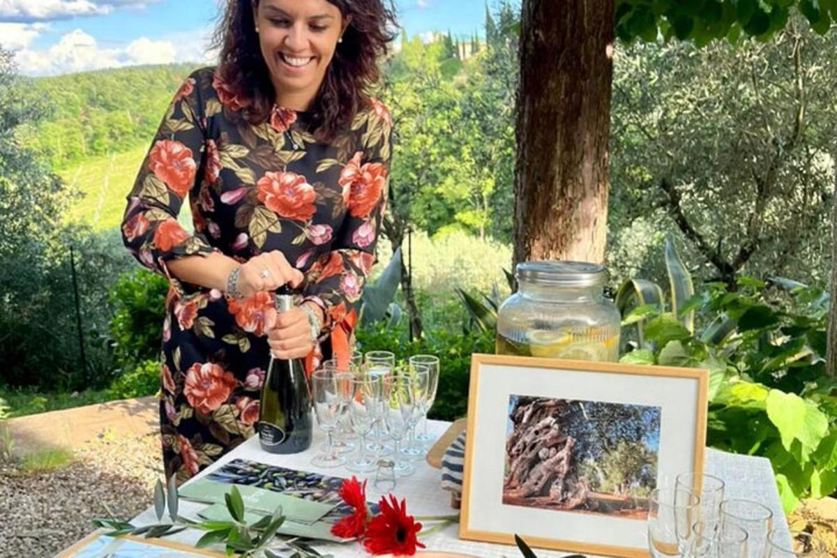 a woman opening a bottle of wine on a table