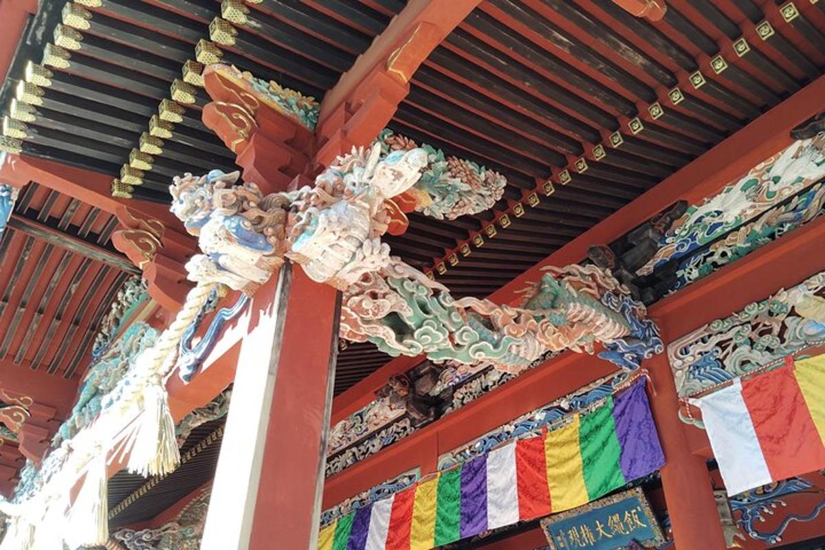 a building with a colorful roof with flags on it