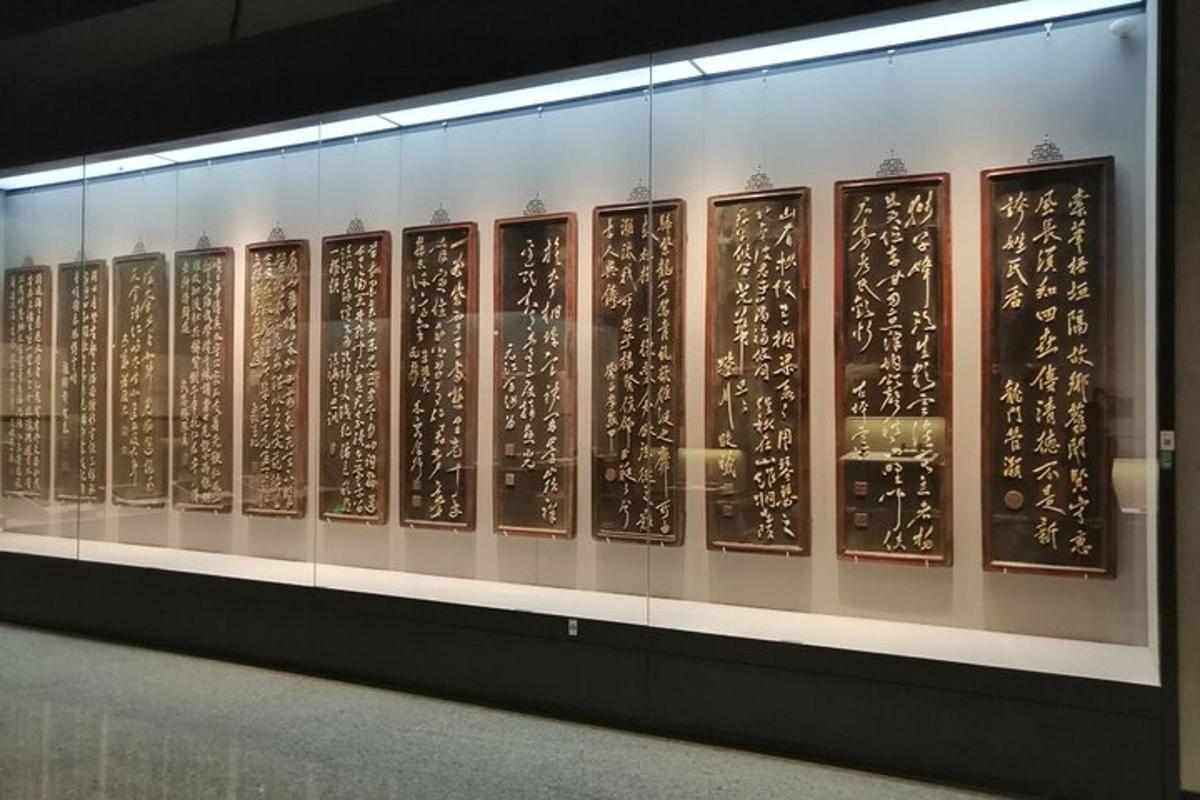 a display of chinese writing on a wall