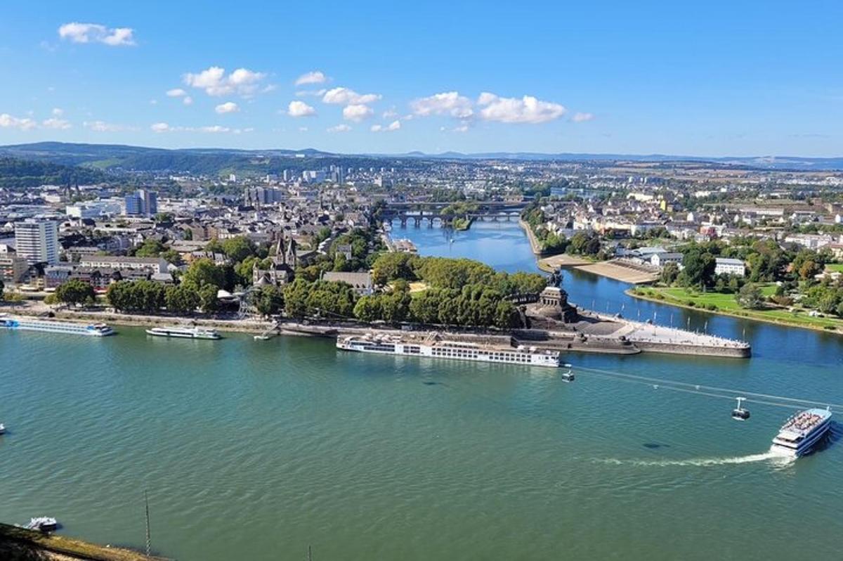 an aerial view of a river with a city