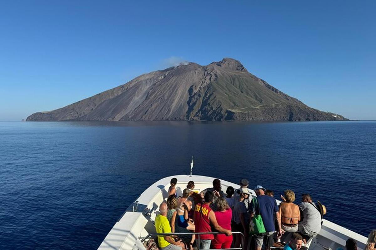 a group of people on a boat in the ocean