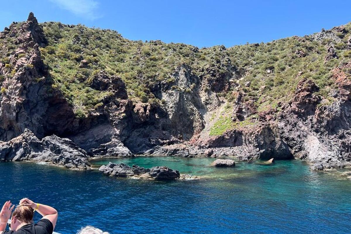 a person taking a picture of a body of water
