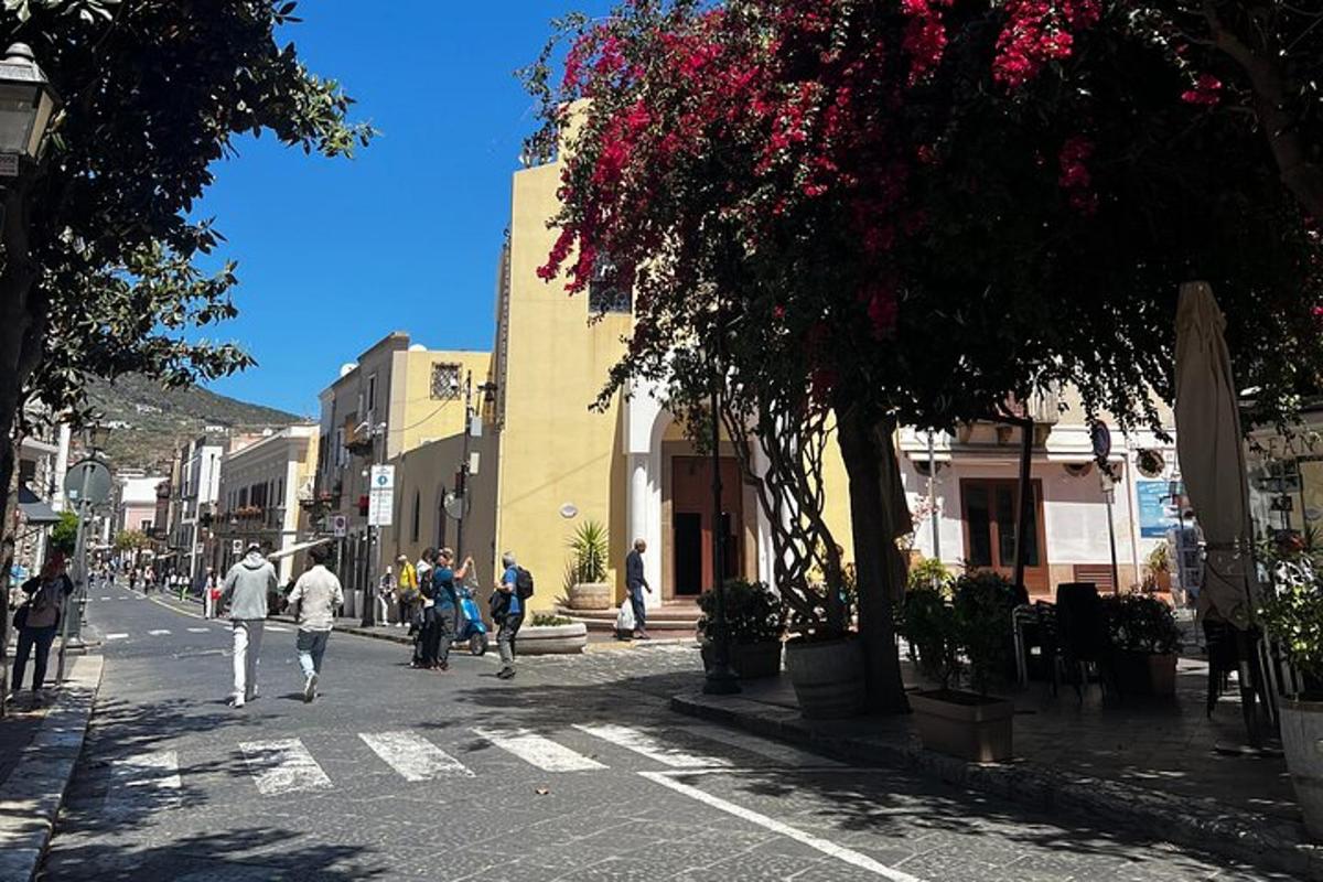 a group of people walking down a city street
