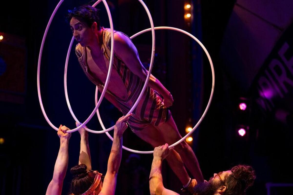 a group of people playing with hula hoop