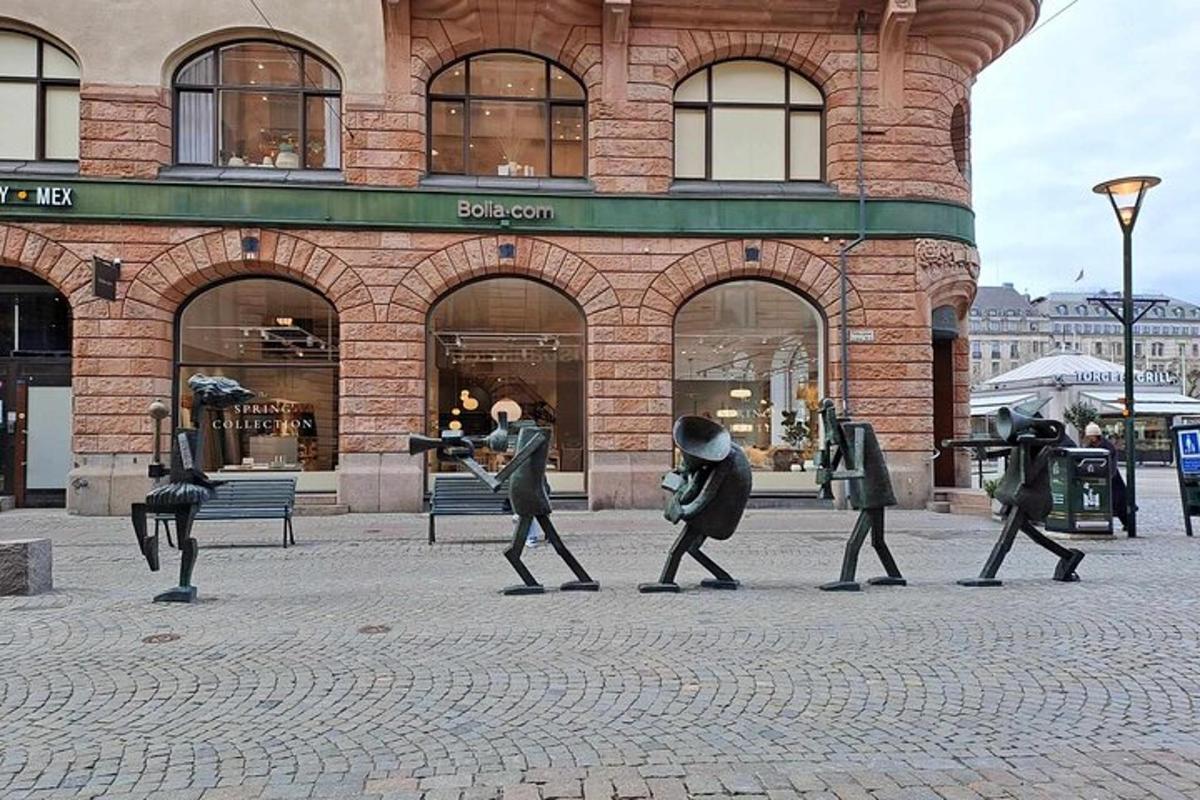 a group of people walking in front of a building