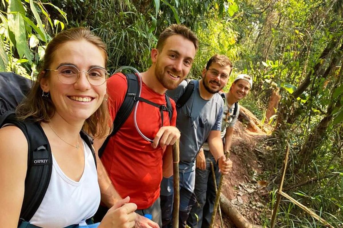 a group of people walking down a trail