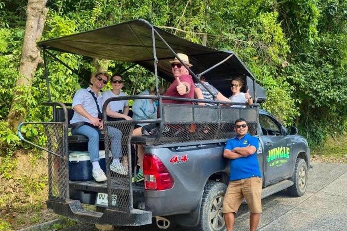 a group of people riding in the back of a truck