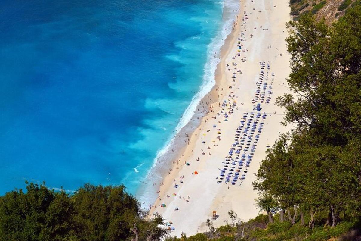 a group of people on a beach near the ocean