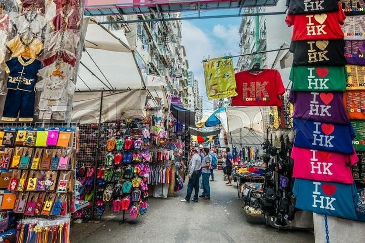 a market with a bunch of shirts and other merchandise