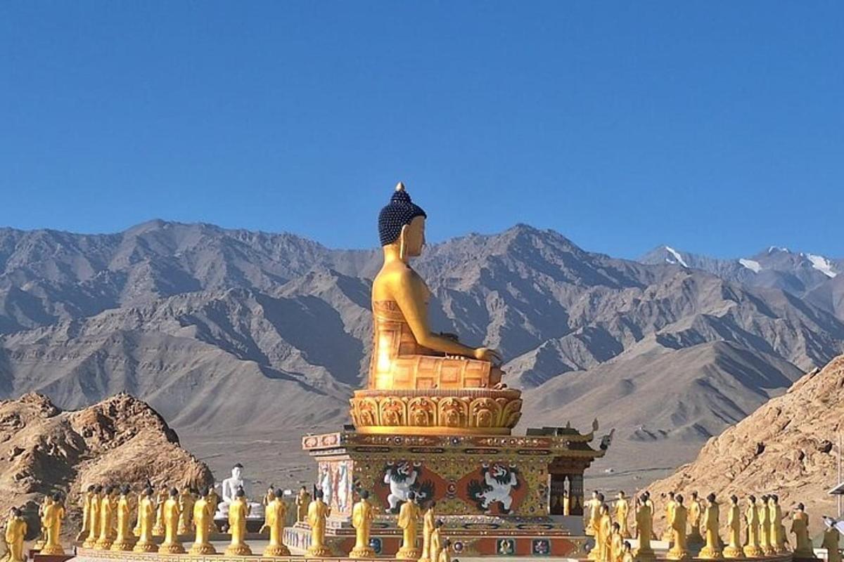 a large statue sitting on top of a mountain