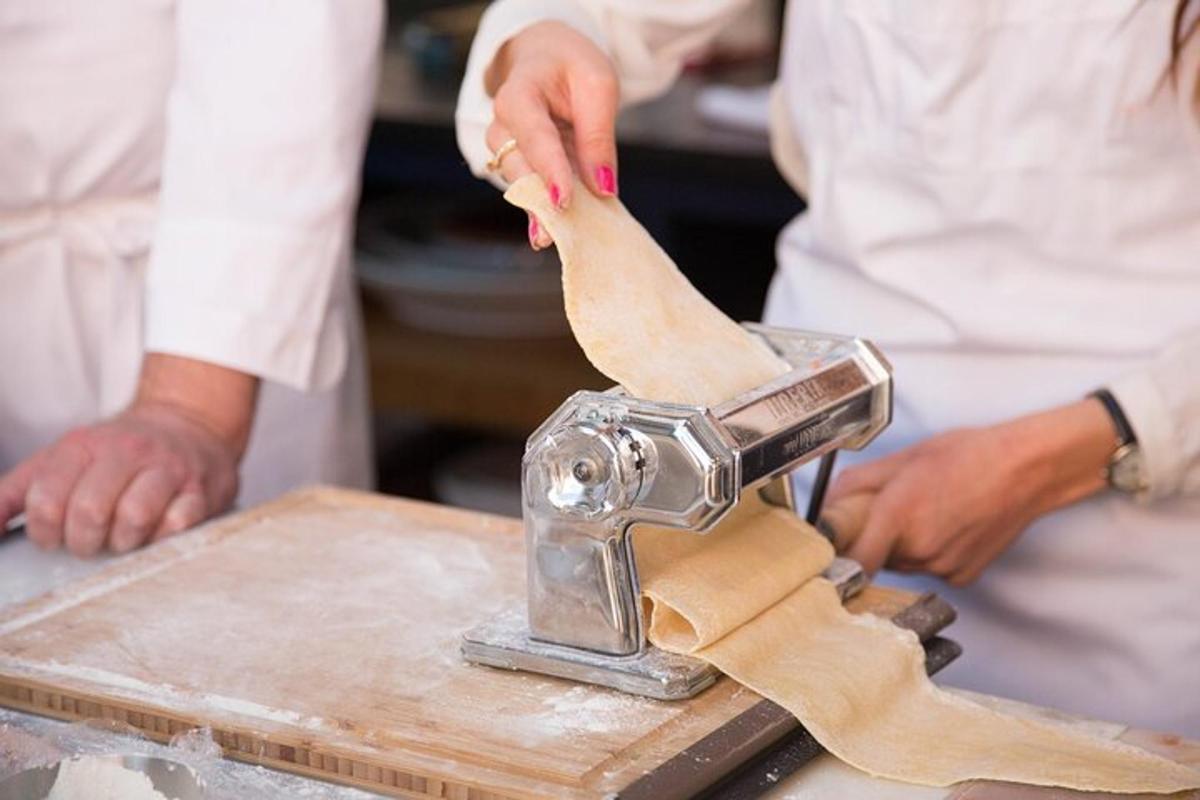 a person is using a mixer on a cutting board