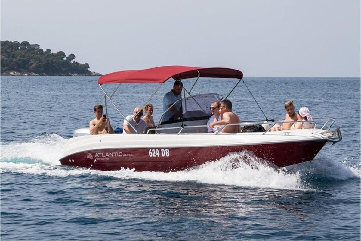 a group of people on a boat in the water