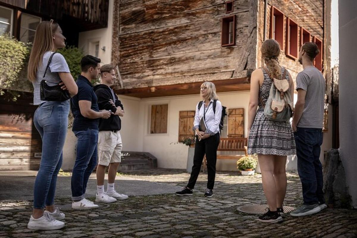 a group of people standing outside of a building