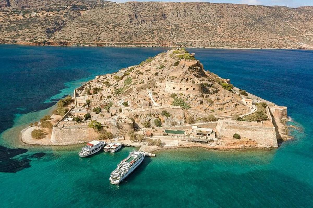 two boats are docked on an island in the water