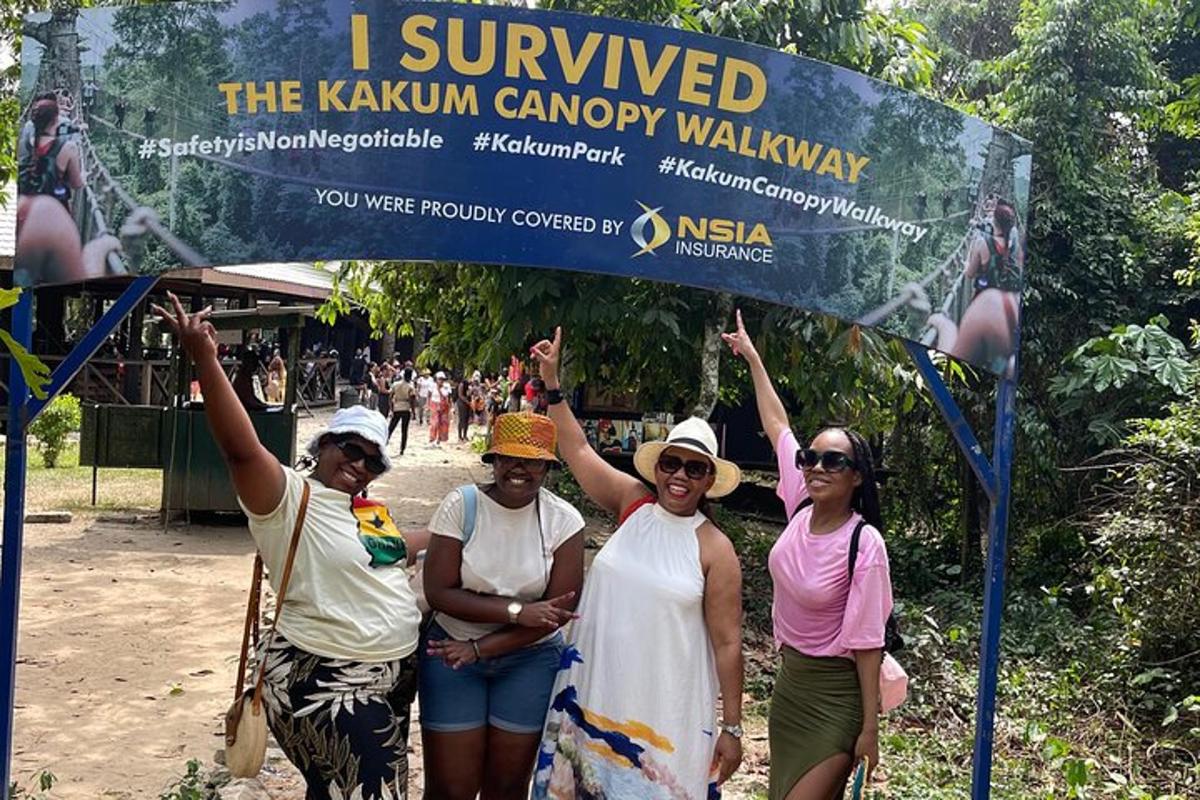 a group of women standing under a sign
