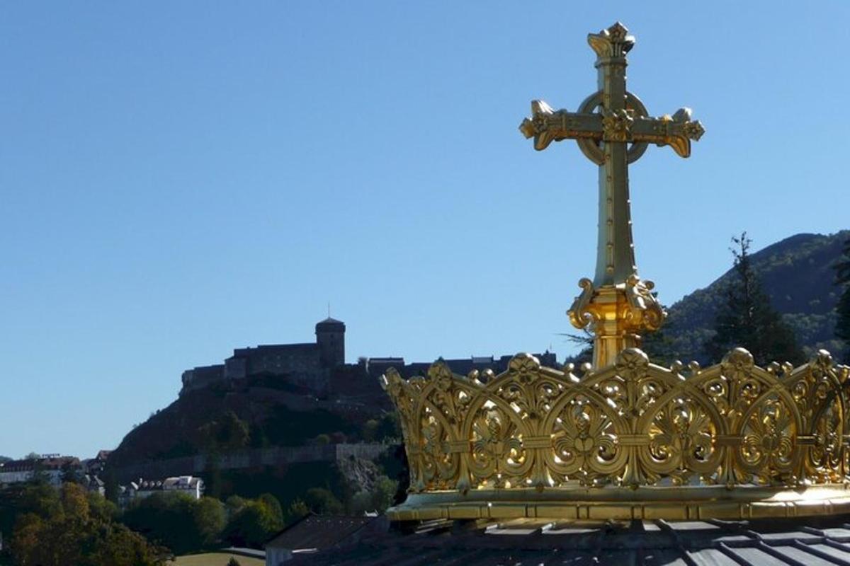 a gold crown with a cross on top of a building