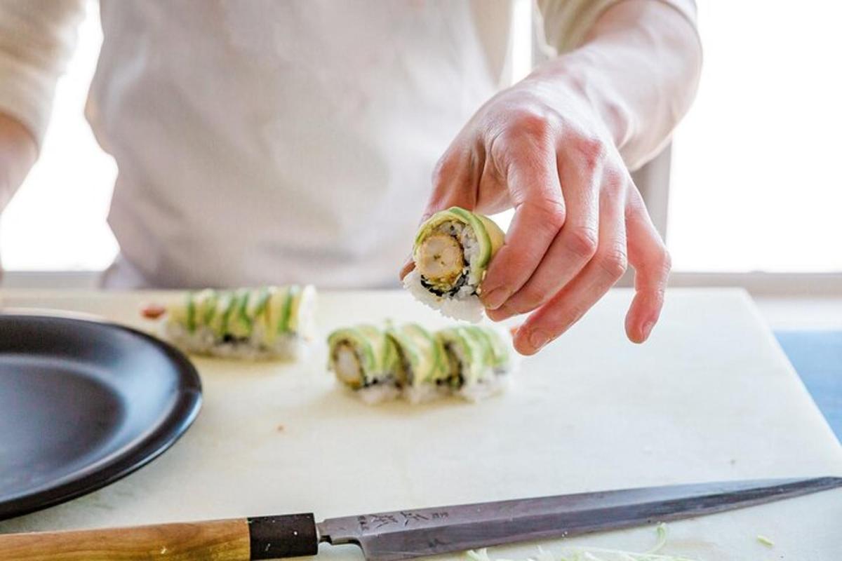 a person is cutting up food on a cutting board
