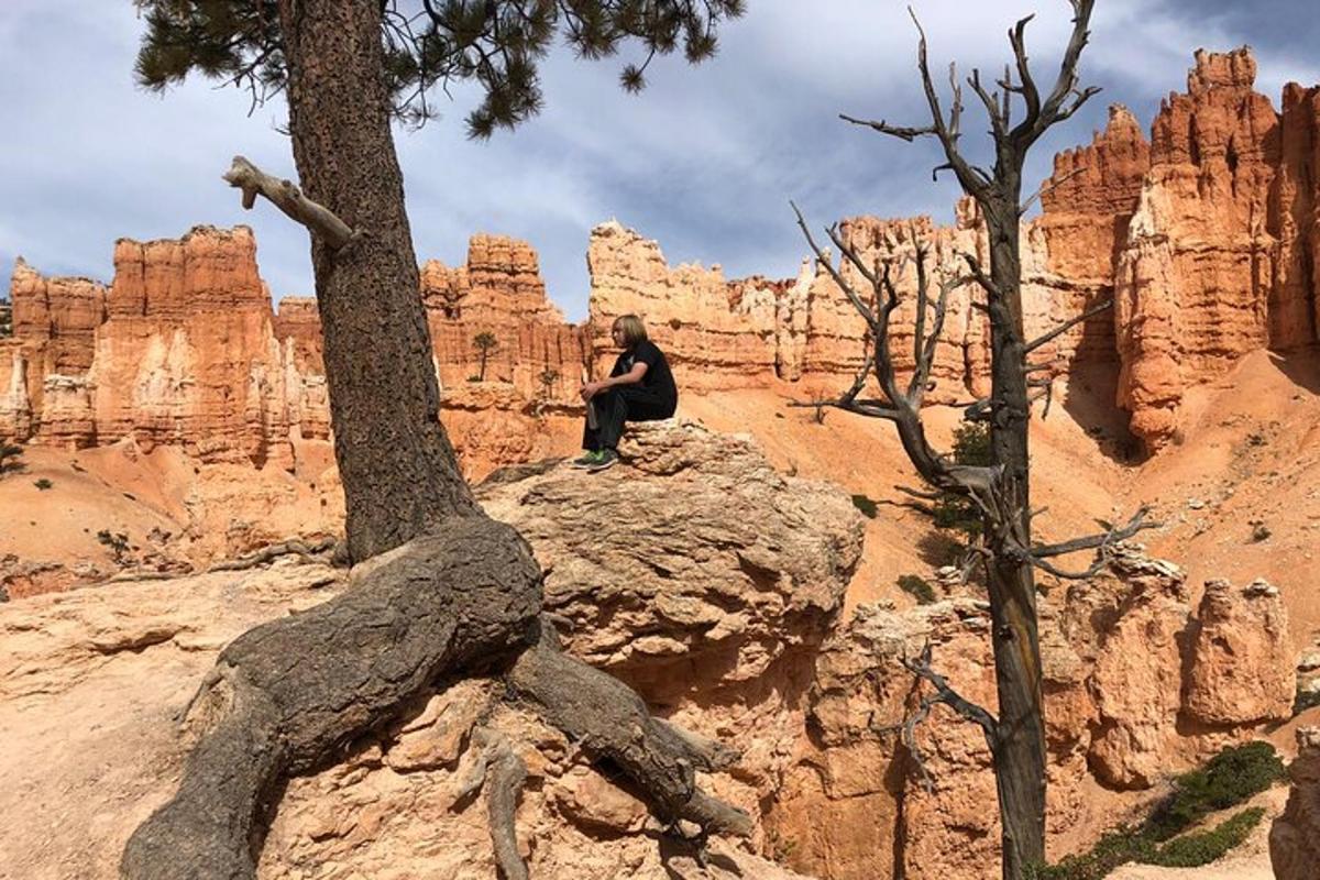 a person sitting on top of a rocky mountain