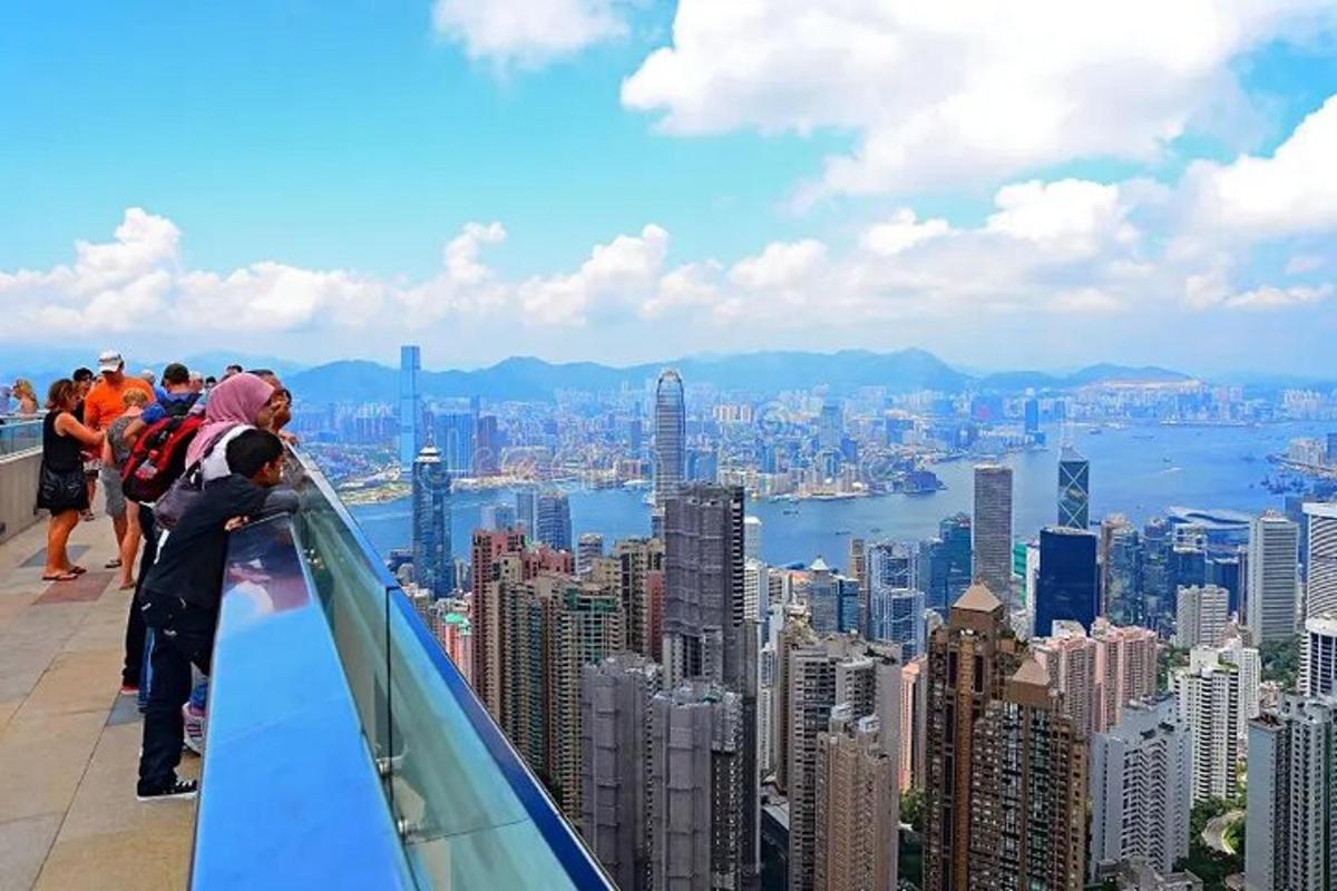 a group of people standing on top of a skyscraper